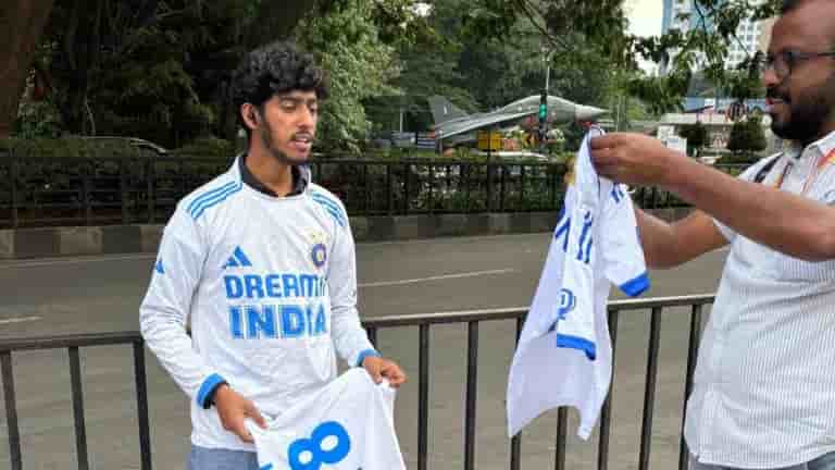 Virat Kohli in white jersey at M Chinnaswamy stadium